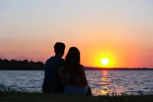 couple enjoying a sunset at the beach